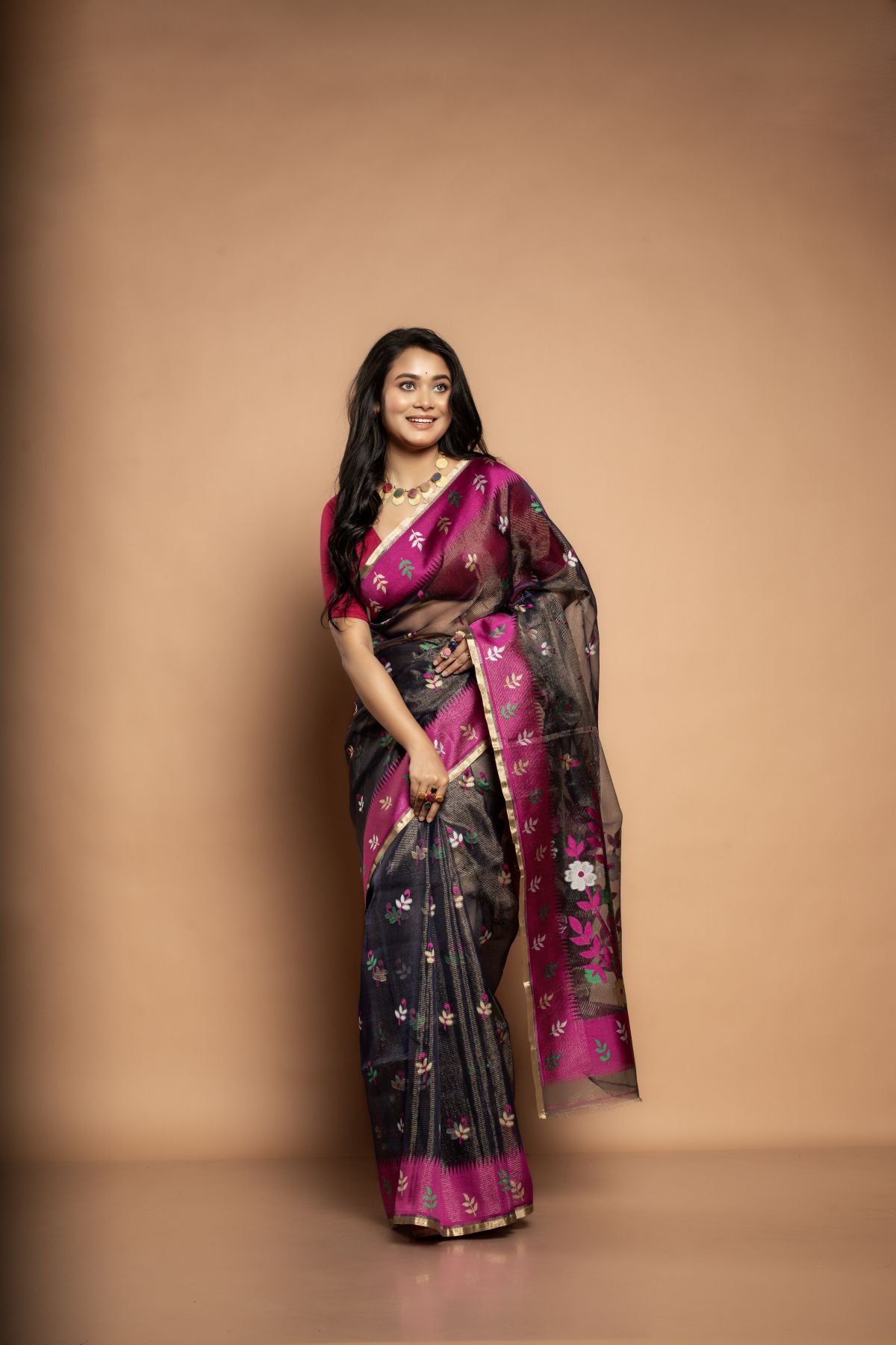 Kalpana | Pure Muslin Tissue Saree with Floral Rani Pink Border in Black