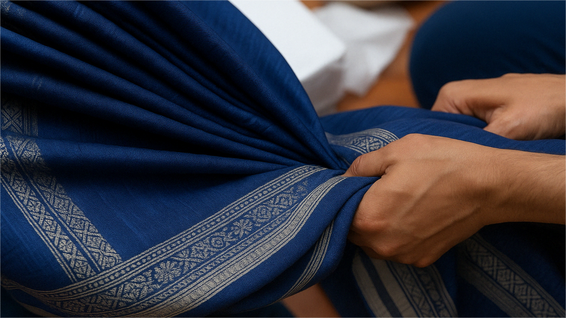 person holding maheshwari silk saree